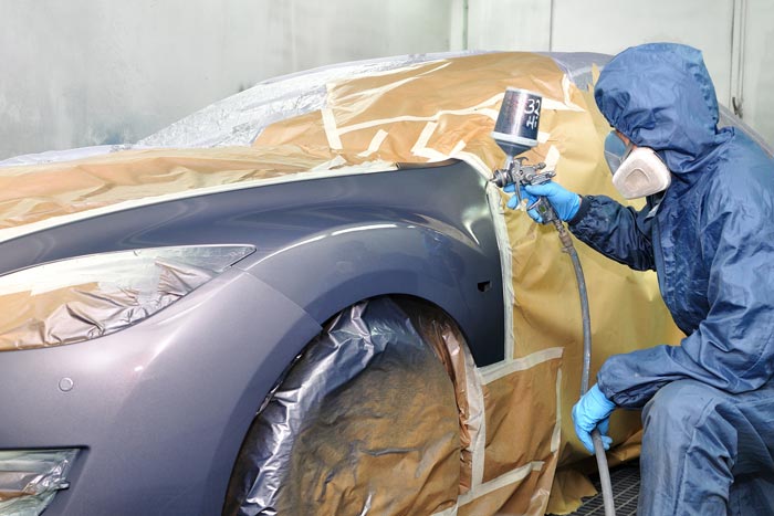 technician painting car